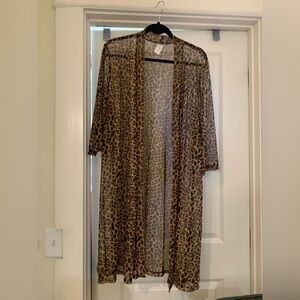 Two Women's sheer dress length jackets.